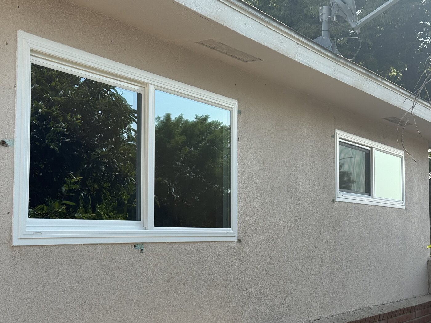 New white vinyl replacement windows on a Fresno, CA home after installation