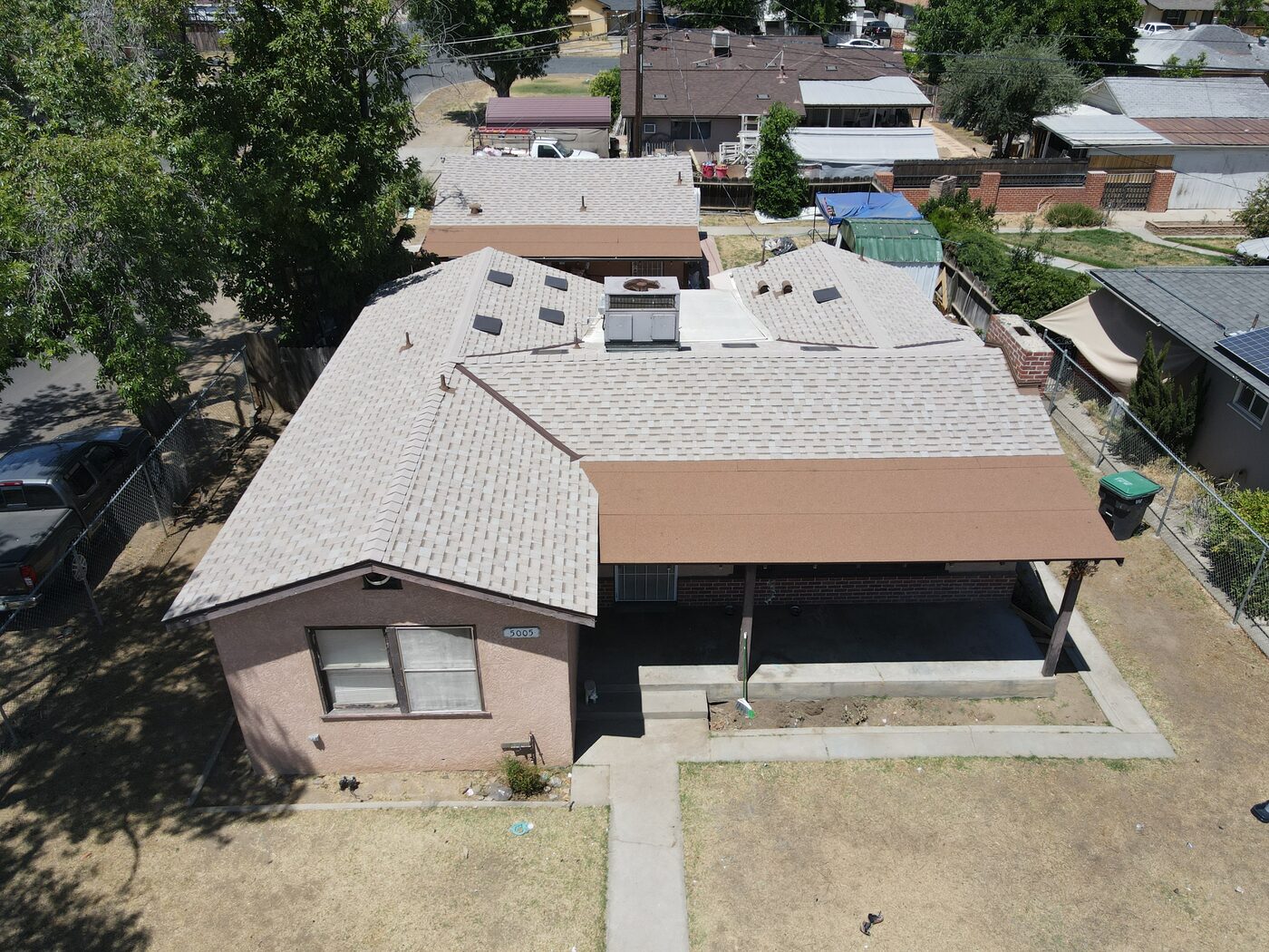 Aerial view of a finished charcoal architectural shingle roof in Fresno, CA